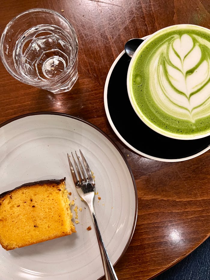 our-services-01 matcha-latte-and-cake-on-wooden-table-33730828